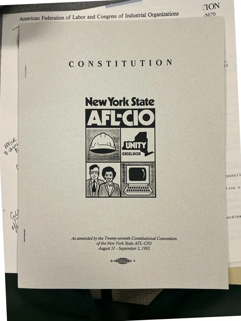 Photograph of a printed constitution: Constitution of the New York State AFL-CIO, as amended 1992 (partial copy), page 1.