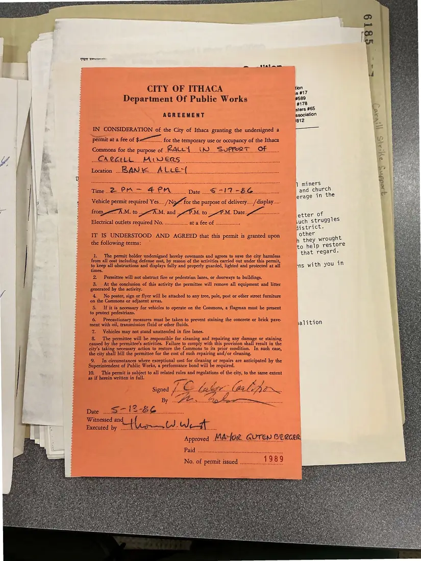 Photograph of a permit: City of Ithaca agreement and Commons permit for a Cargill support rally, page 1.
