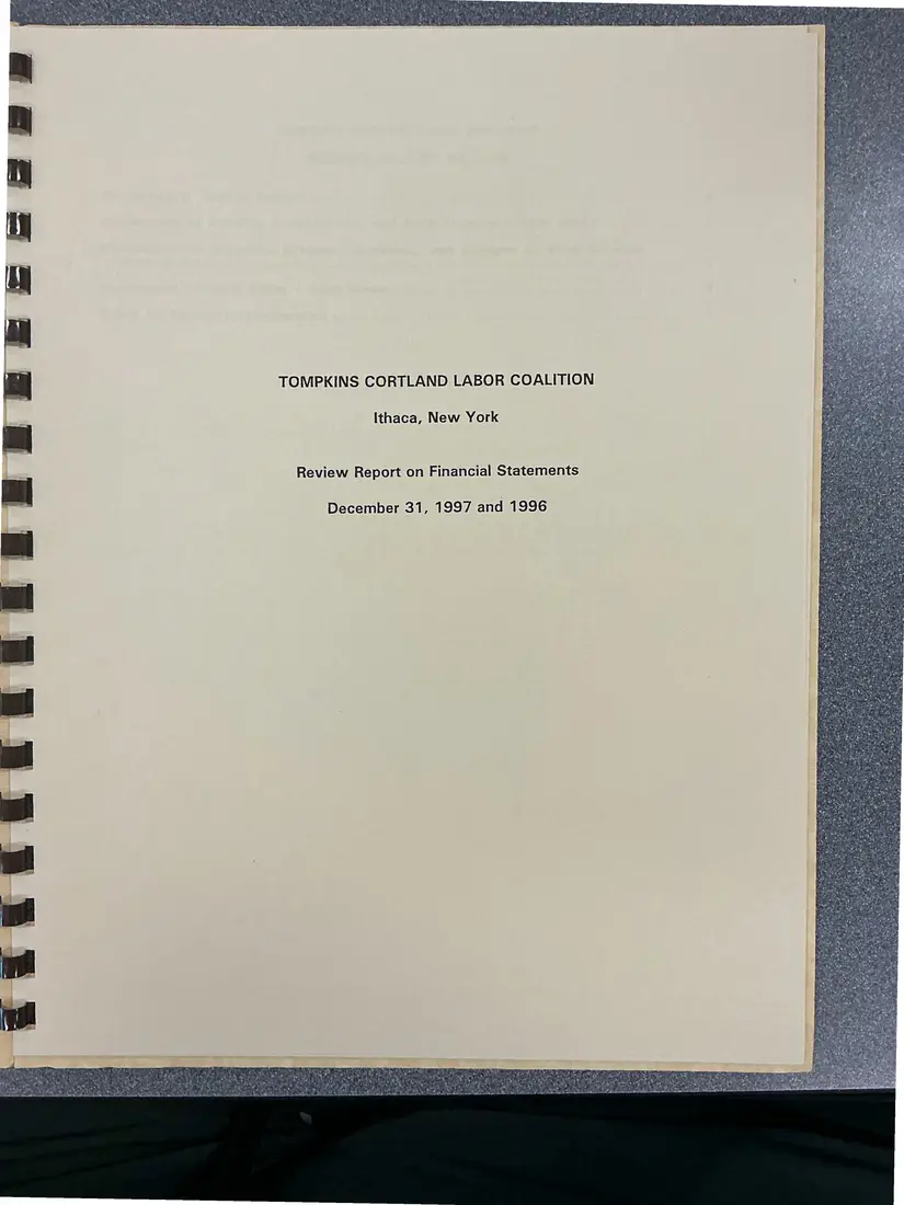 Photograph of a financial report: Tompkins Cortland Labor Coalition review report on financial statements, 1997 and 1996, page 1.
