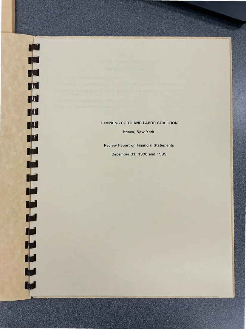 Photograph of a financial report: Tompkins Cortland Labor Coalition review report on financial statements, 1996 and 1995, page 1.