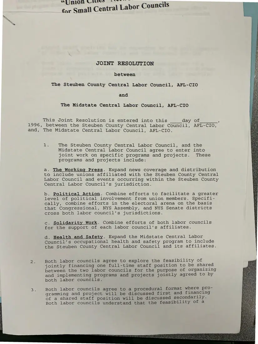 Photograph of a draft agreement: Joint resolution between the Steuben County and Midstate central labor councils, page 1.