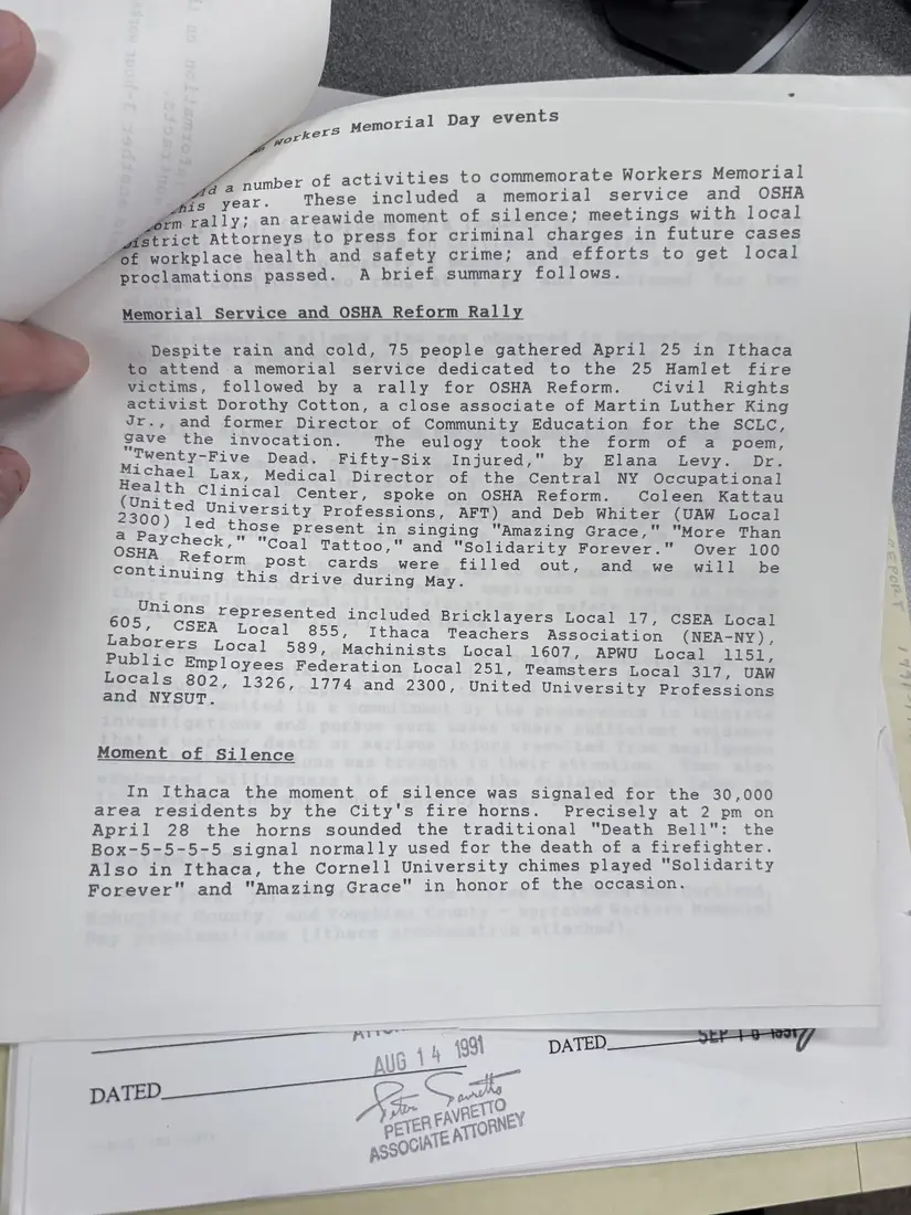 Photograph of a report: Workers Memorial Day events report, April 1992, page 1.