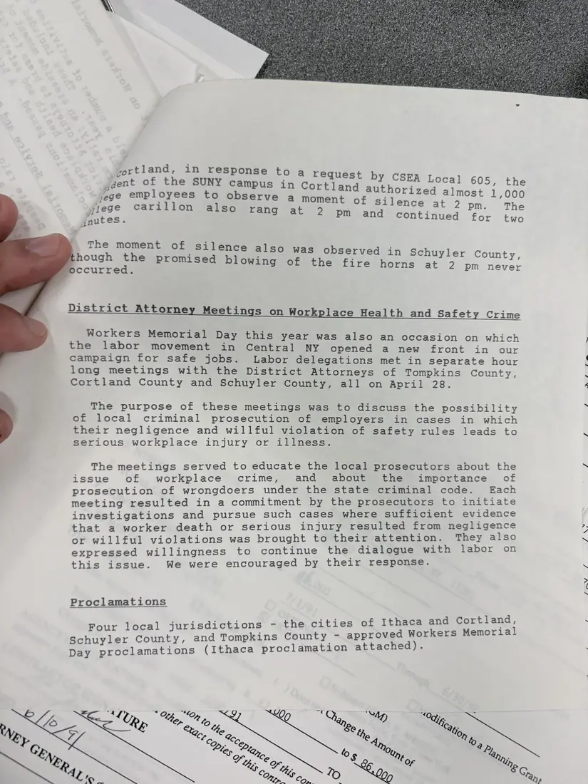Photograph of a report: Workers Memorial Day events report, April 1992, page 2.