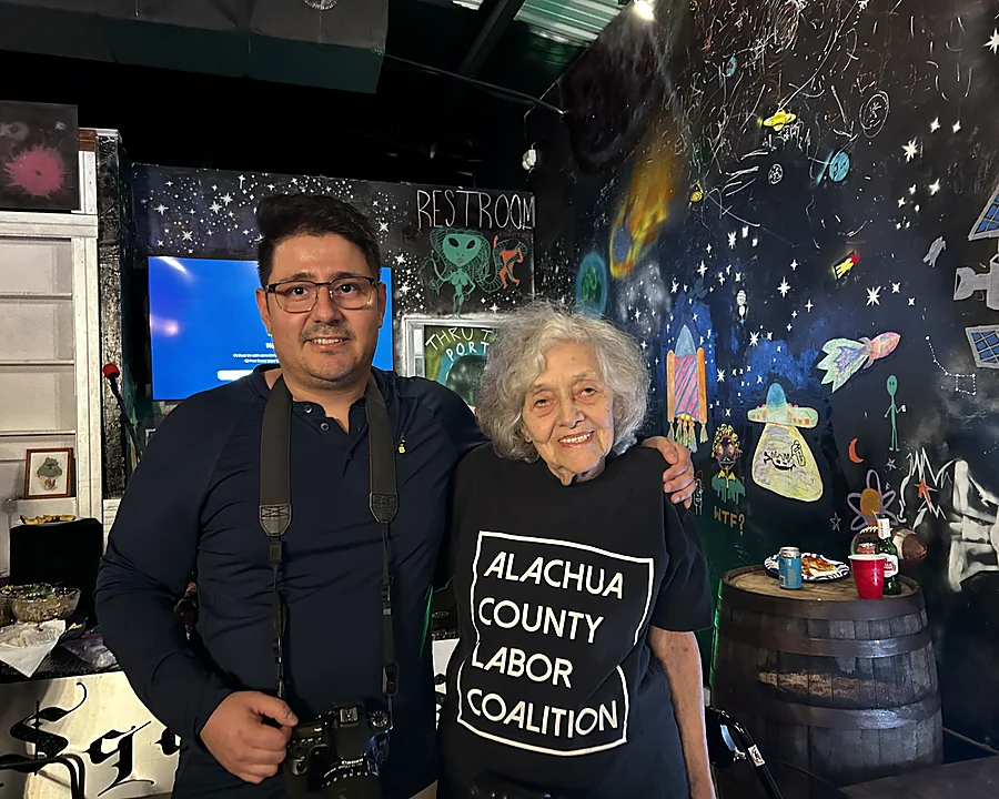 Adolfho Romero with an elder member of the Alachua County Labor Coalition